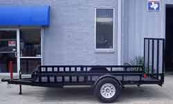 Double ATV trailer ramps stowed